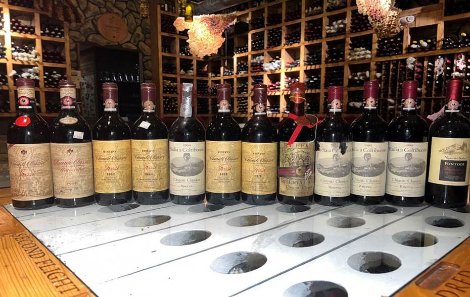 A group of bottles on a counter  Description automatically generated with low confidence