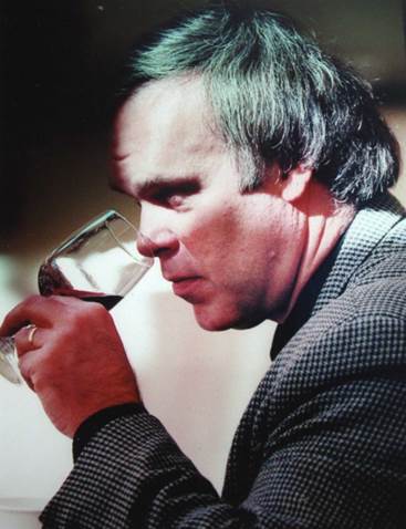 A person drinking from a glass  Description automatically generated