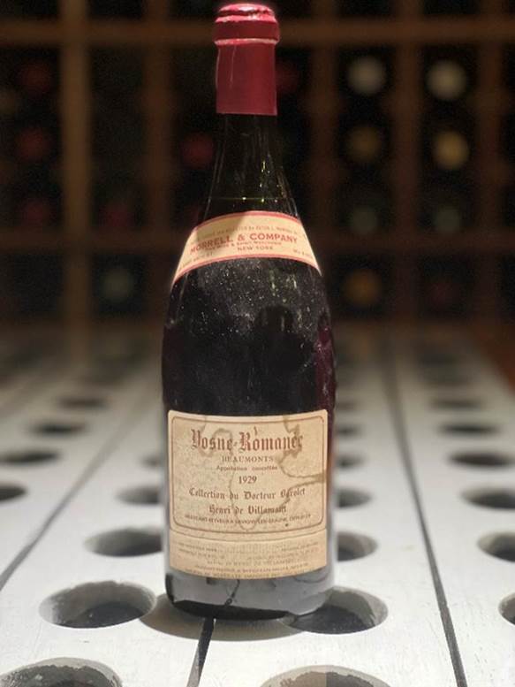 A bottle of liquor on a table  Description automatically generated with medium confidence