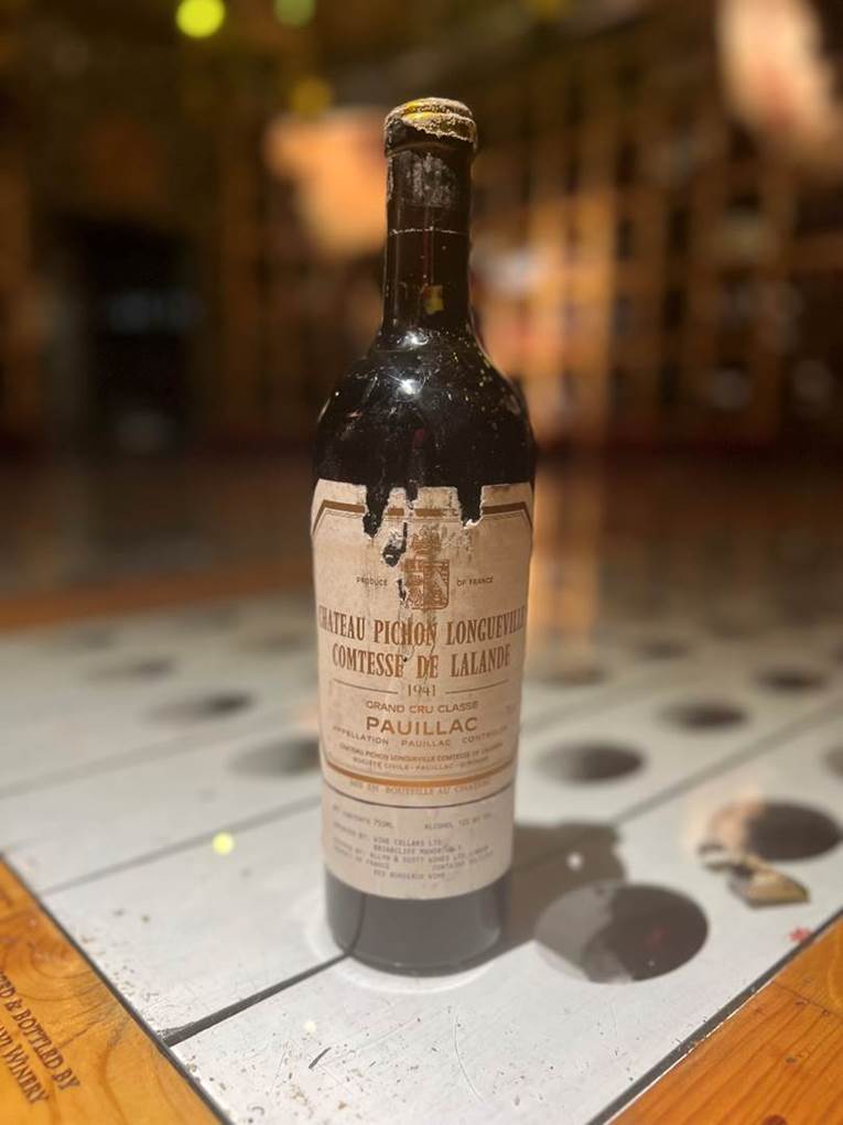 A bottle of liquor on a table  Description automatically generated with medium confidence