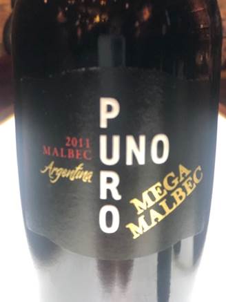 A picture containing text, beverage, alcohol, close    Description automatically generated