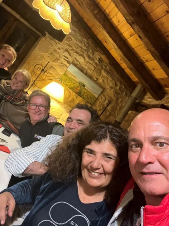 A group of people taking a selfie  Description automatically generated