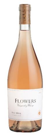 A bottle of liquid with a white label  Description automatically generated